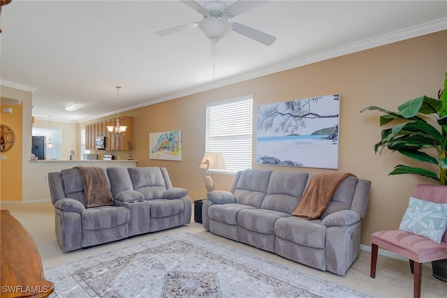 living room with carpet, ceiling fan with notable chandelier, and ornamental molding