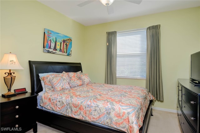 bedroom featuring ceiling fan and light colored carpet