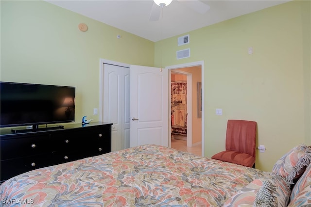 bedroom with ceiling fan and a closet