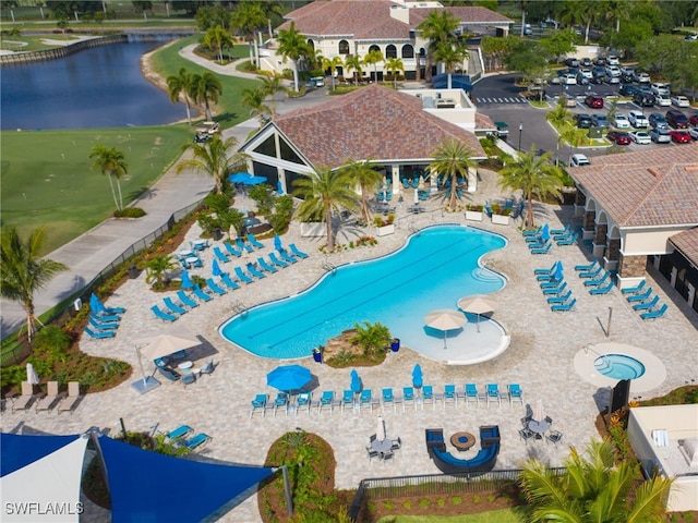 view of pool featuring a water view