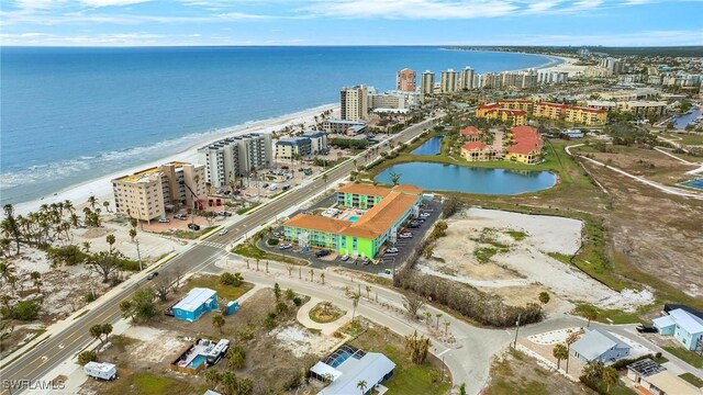 bird's eye view featuring a water view and a view of the beach