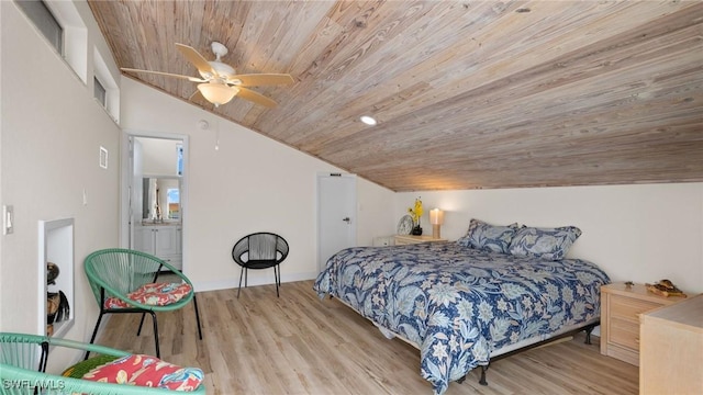 bedroom featuring connected bathroom, ceiling fan, light hardwood / wood-style floors, lofted ceiling, and wood ceiling