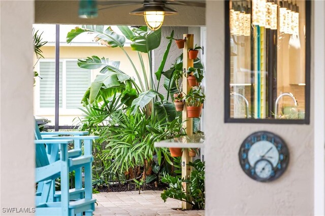 exterior space featuring ceiling fan and a patio area