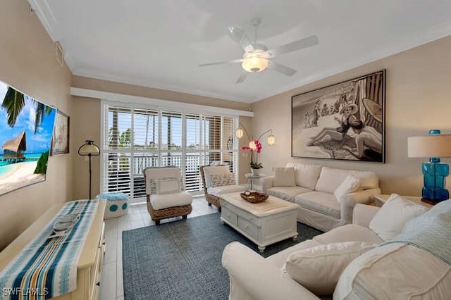 living room with ornamental molding and ceiling fan