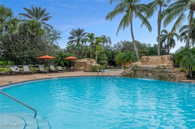 view of pool with pool water feature and a patio area