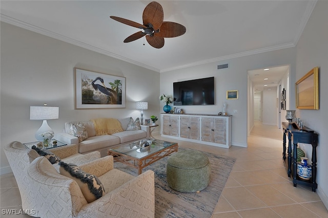 tiled living room featuring ceiling fan and ornamental molding