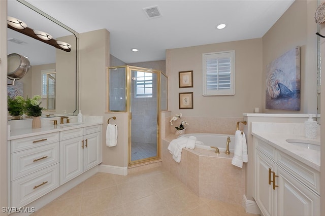 bathroom featuring tile patterned flooring, vanity, and separate shower and tub