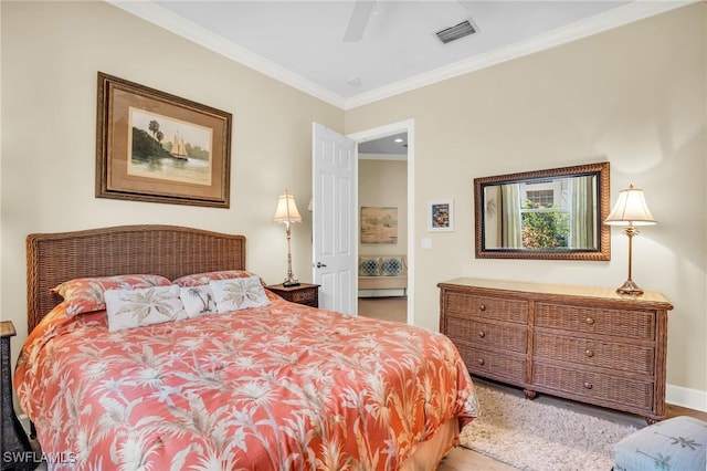 bedroom featuring ceiling fan and ornamental molding