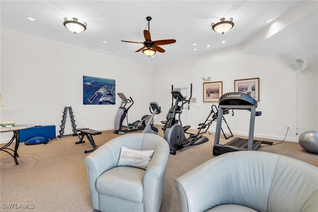 exercise room with light colored carpet and ceiling fan