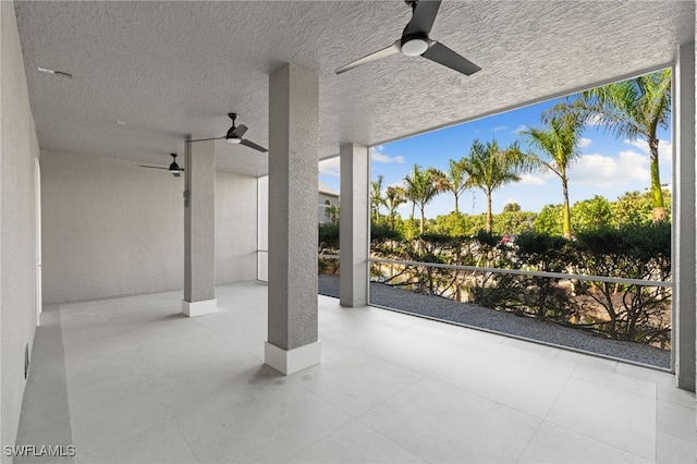 view of patio / terrace featuring ceiling fan