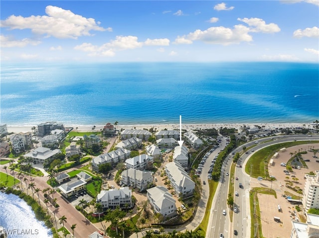 drone / aerial view with a view of the beach and a water view