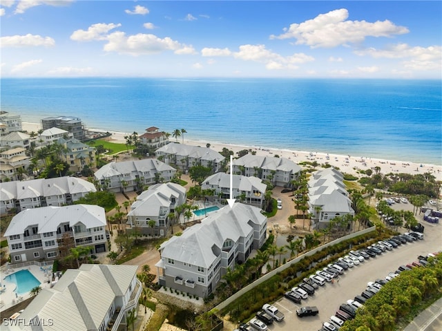 aerial view featuring a view of the beach and a water view