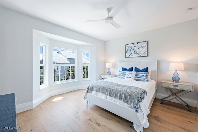 bedroom featuring ceiling fan and light hardwood / wood-style floors