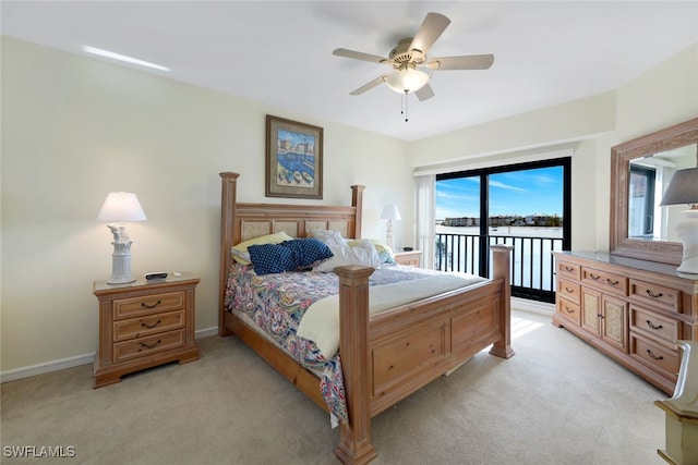 carpeted bedroom featuring access to exterior and ceiling fan