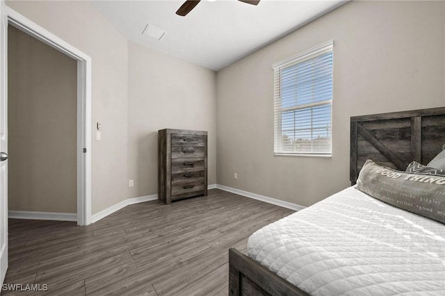 bedroom featuring ceiling fan and dark hardwood / wood-style floors