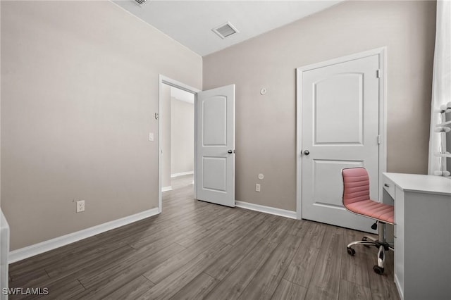 unfurnished office featuring wood-type flooring