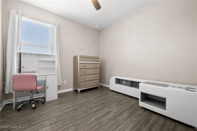 office area with dark hardwood / wood-style floors and ceiling fan