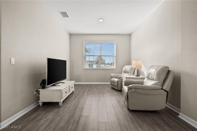 sitting room featuring dark hardwood / wood-style flooring