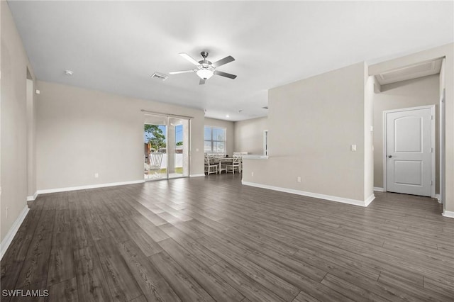 unfurnished living room with dark hardwood / wood-style flooring and ceiling fan