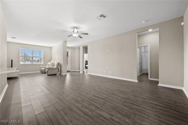 unfurnished living room with dark hardwood / wood-style floors and ceiling fan