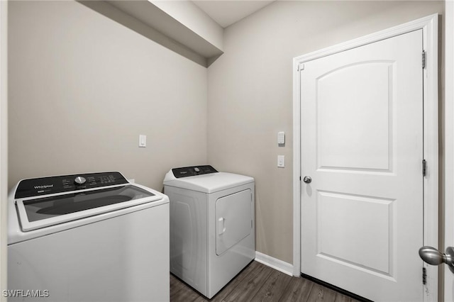 washroom featuring separate washer and dryer and dark hardwood / wood-style floors