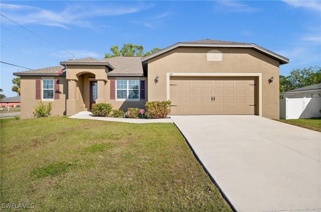 view of front facade with a front lawn and a garage