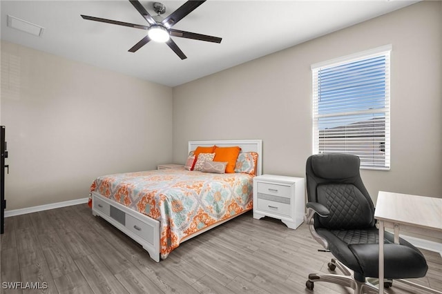 bedroom featuring hardwood / wood-style flooring and ceiling fan