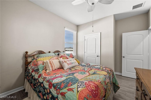 bedroom featuring ceiling fan and light hardwood / wood-style flooring