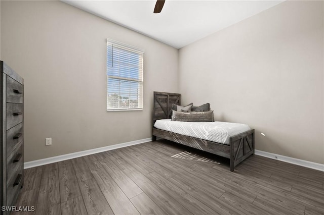 bedroom featuring ceiling fan and dark hardwood / wood-style flooring