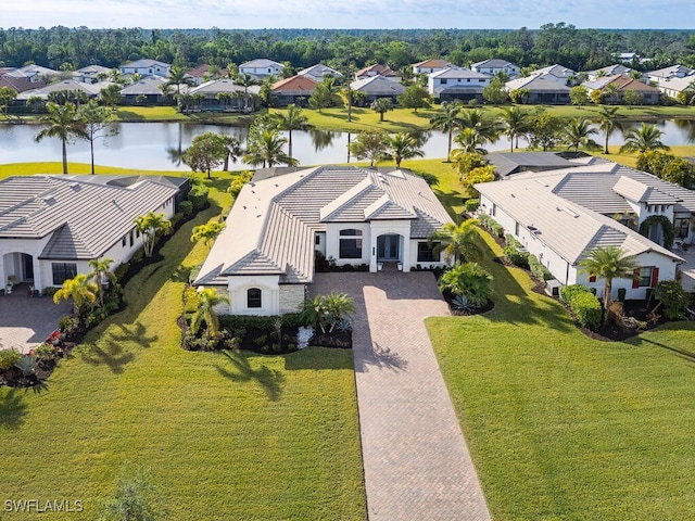 birds eye view of property with a water view