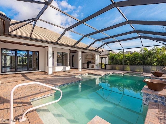 view of pool featuring a lanai, ceiling fan, and a patio