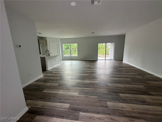 942 Sunrise Blvd, Lehigh Acres, FL 33974 - spare room with dark wood-style flooring and recessed lighting