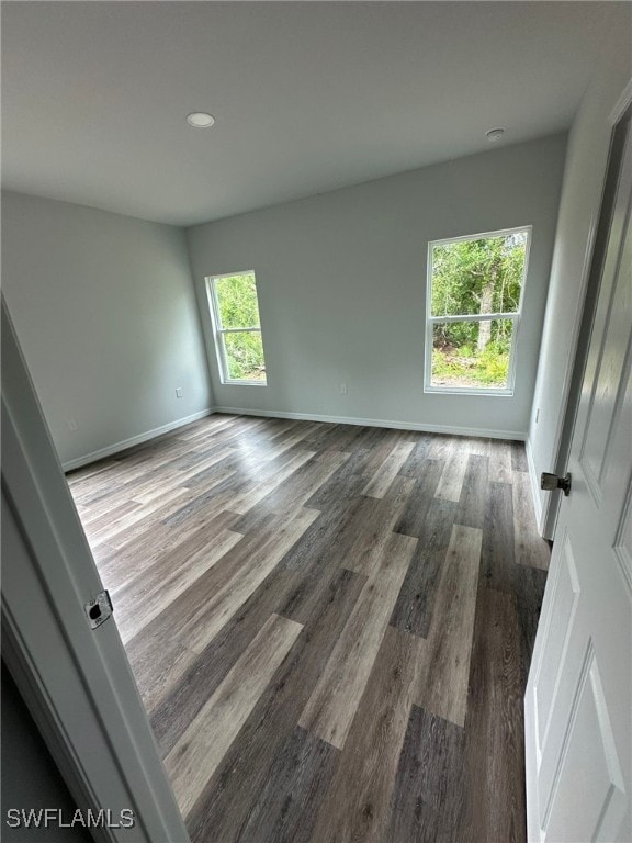 942 Sunrise Blvd, Lehigh Acres, FL 33974 - spare room featuring wood finished floors and recessed lighting