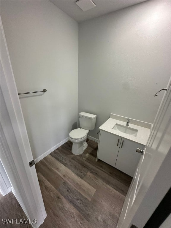 942 Sunrise Blvd, Lehigh Acres, FL 33974 - bathroom featuring wood finished floors and vanity