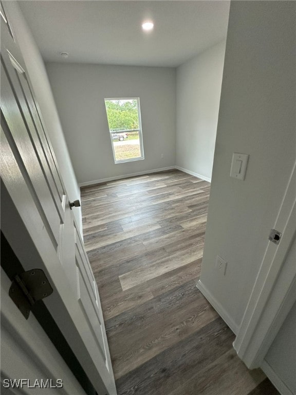 942 Sunrise Blvd, Lehigh Acres, FL 33974 - empty room featuring wood finished floors and recessed lighting