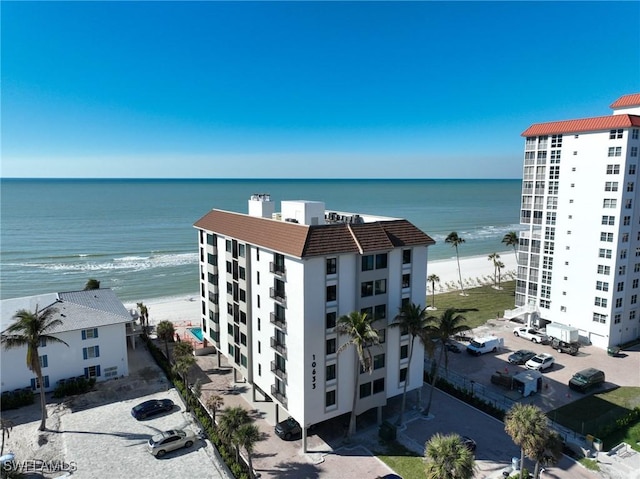 bird's eye view featuring a beach view and a water view