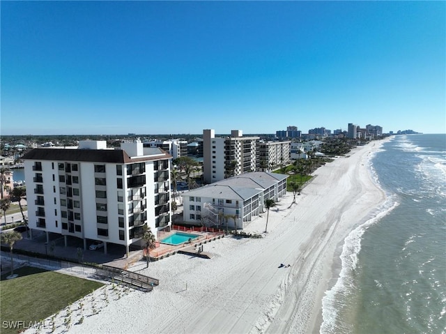 birds eye view of property with a view of the beach and a water view