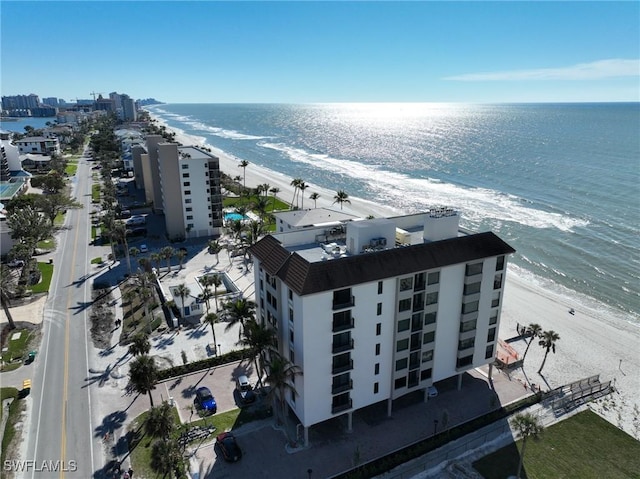 aerial view featuring a view of the beach and a water view