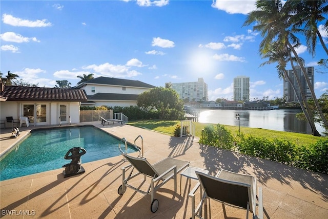 319 Pirates Bight, Naples, FL 34103 - outdoor pool with a patio area, a city view, fence, and a water view