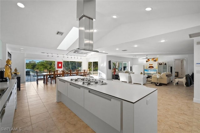 319 Pirates Bight, Naples, FL 34103 - kitchen featuring visible vents, white cabinetry, modern cabinets, and white gas cooktop