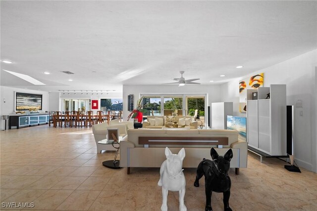 319 Pirates Bight, Naples, FL 34103 - living room featuring light tile patterned floors and recessed lighting