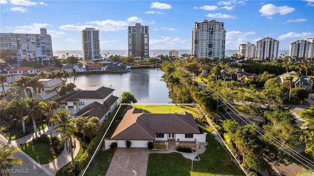 bird's eye view featuring a water view and a city view