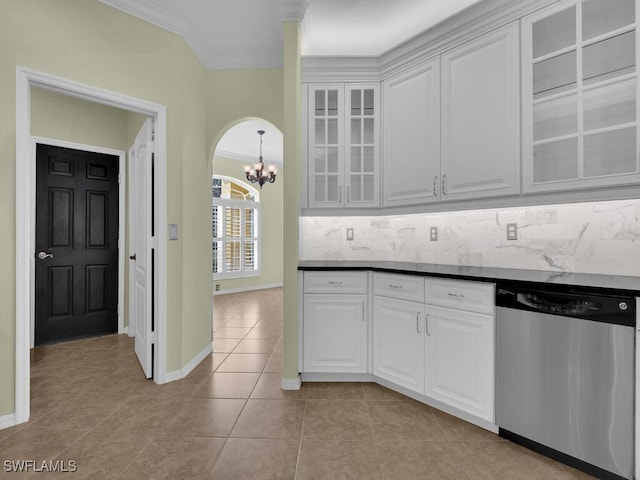 kitchen with dishwasher, a notable chandelier, light tile patterned floors, backsplash, and white cabinetry