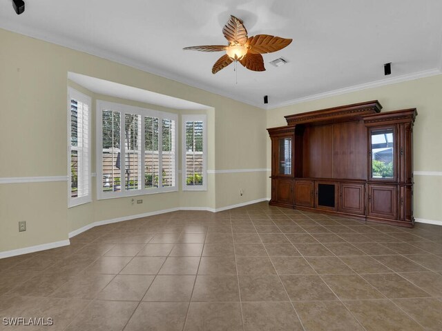 unfurnished living room with ceiling fan, ornamental molding, and light tile patterned flooring