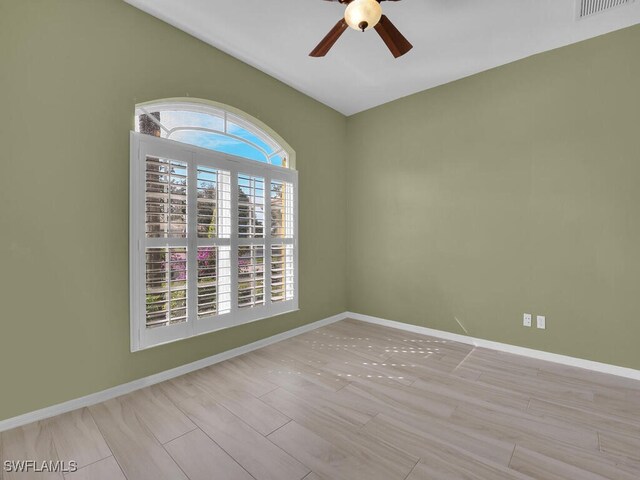 spare room with ceiling fan