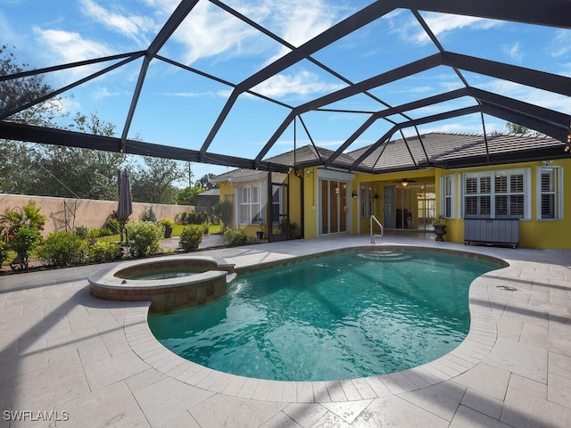 view of swimming pool featuring a lanai, a patio area, ceiling fan, and an in ground hot tub