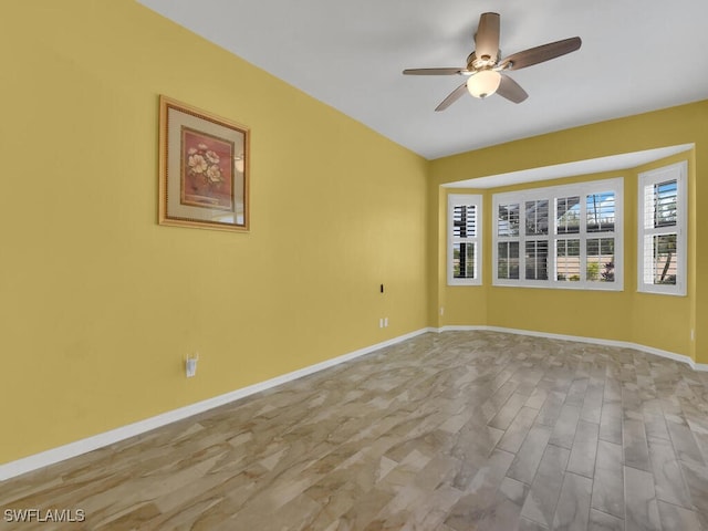 empty room featuring ceiling fan and light hardwood / wood-style floors