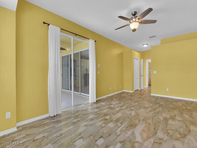 unfurnished room featuring ceiling fan and light hardwood / wood-style flooring