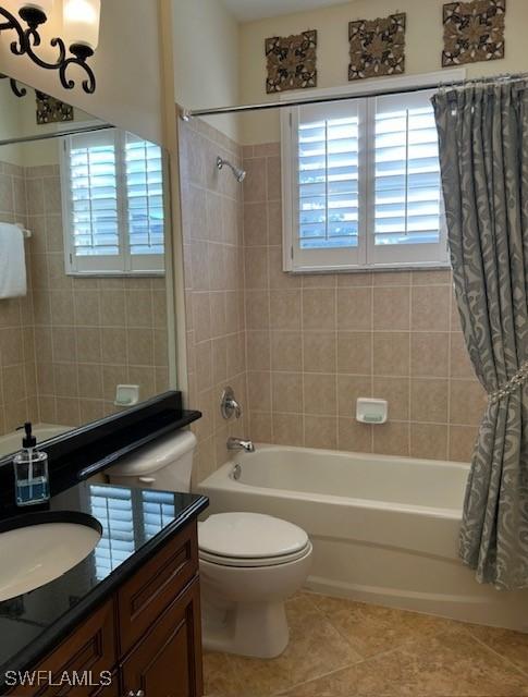 full bathroom featuring shower / bath combination with curtain, vanity, toilet, and tile patterned flooring