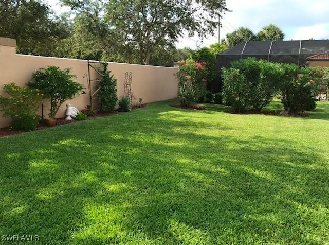 view of yard featuring a lanai